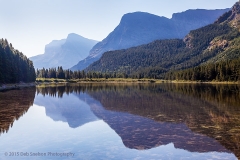 Fishercap_Lake_reflections_in_smoke_Glacier_National_Park_Montana_USA